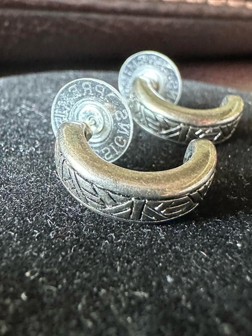 Vintage silver half hoop engraved design earrings.
